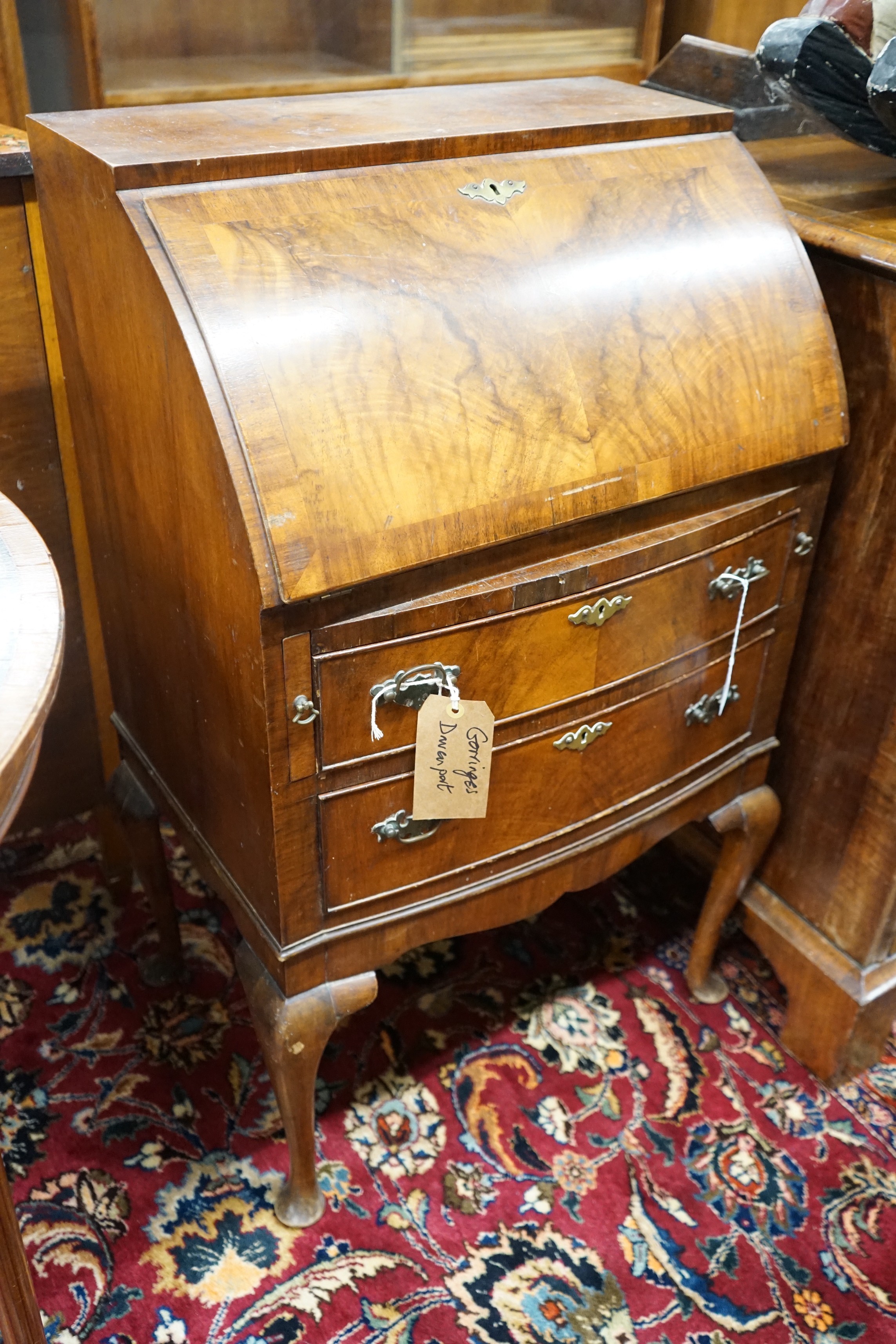 A reproduction walnut bow front bureau, width 58cm, depth 42cm, height 98cm